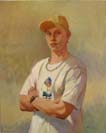 Young man in cap with arms folded